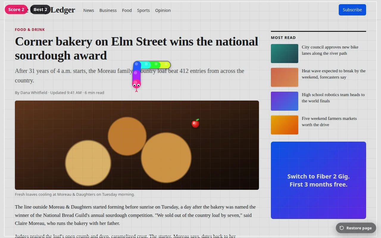 A colourful snake game played over a news page